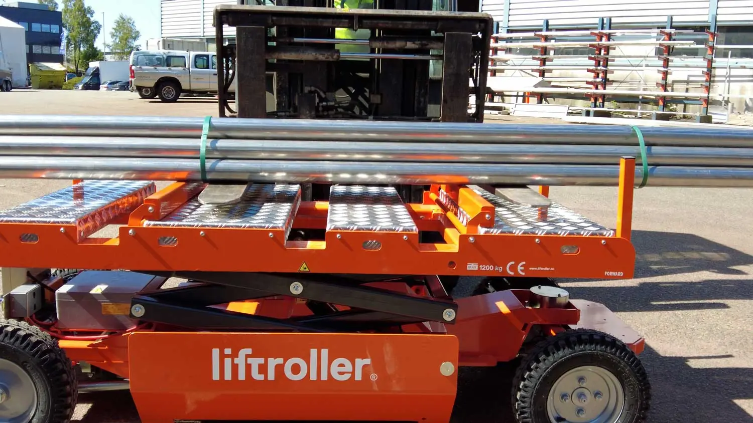 Steel pipe being loaded onto a Liftroller E Mover