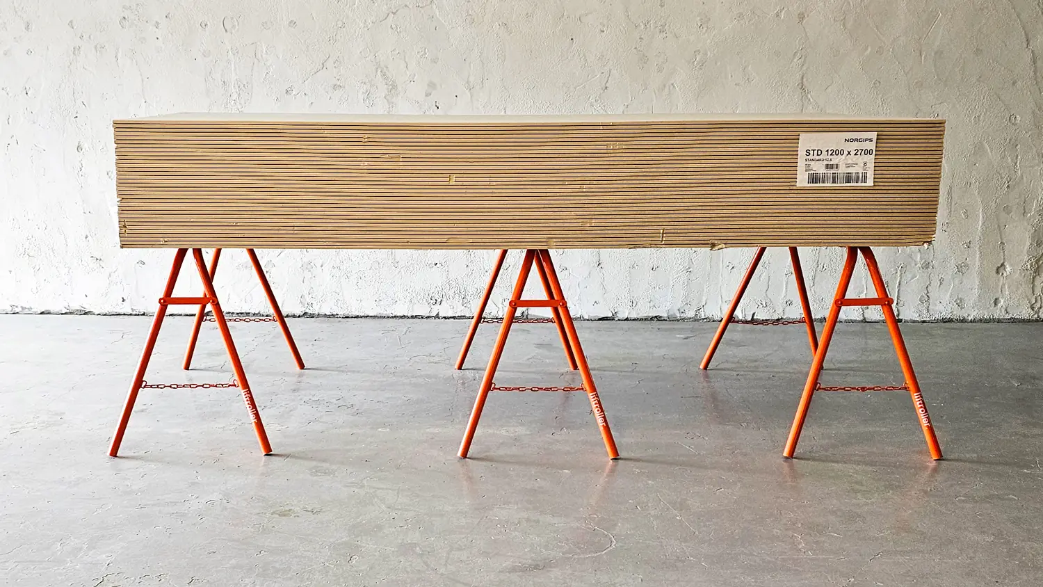 A pack of plasterboard resting on Liftroller Trestles at working height